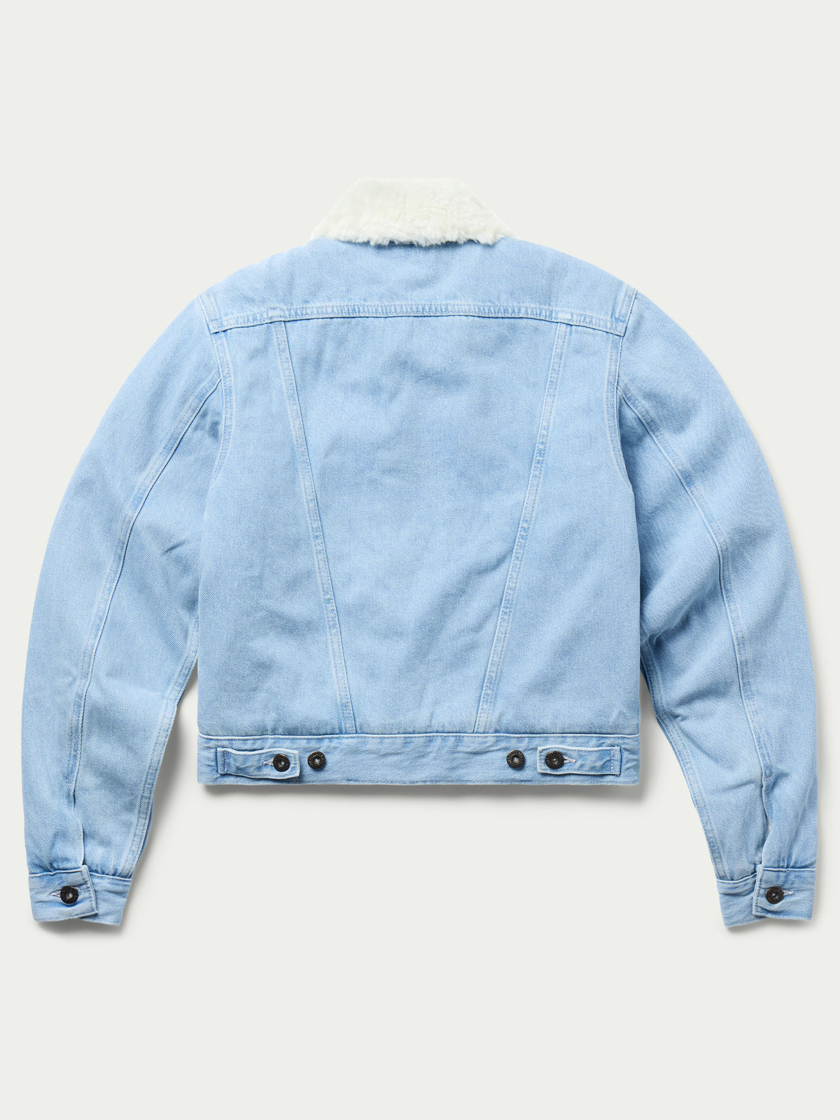Light wash denim jacket with sherpa lining on collar and hem, buttoned cuffs
