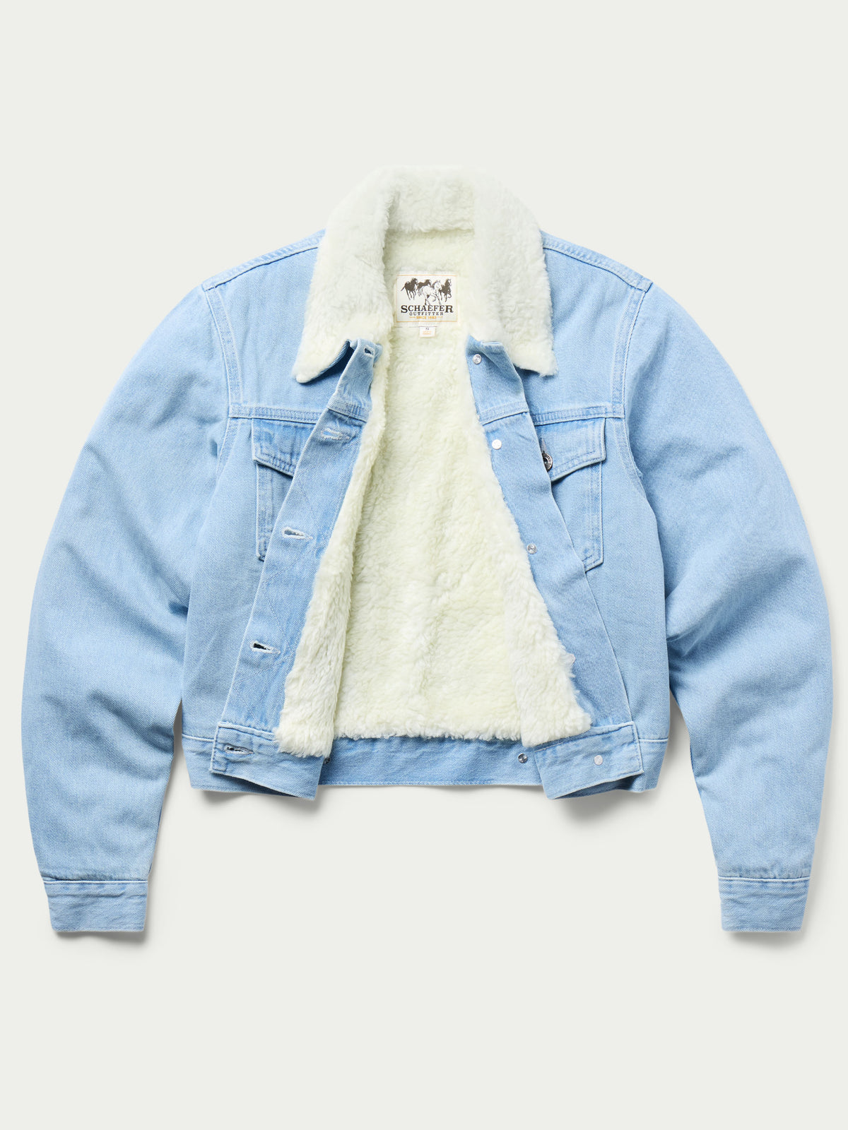 Light wash denim jacket with cream sherpa interior lining and button front