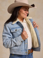 Light wash denim jacket with sherpa lining, sherpa collar, button front, chest pockets