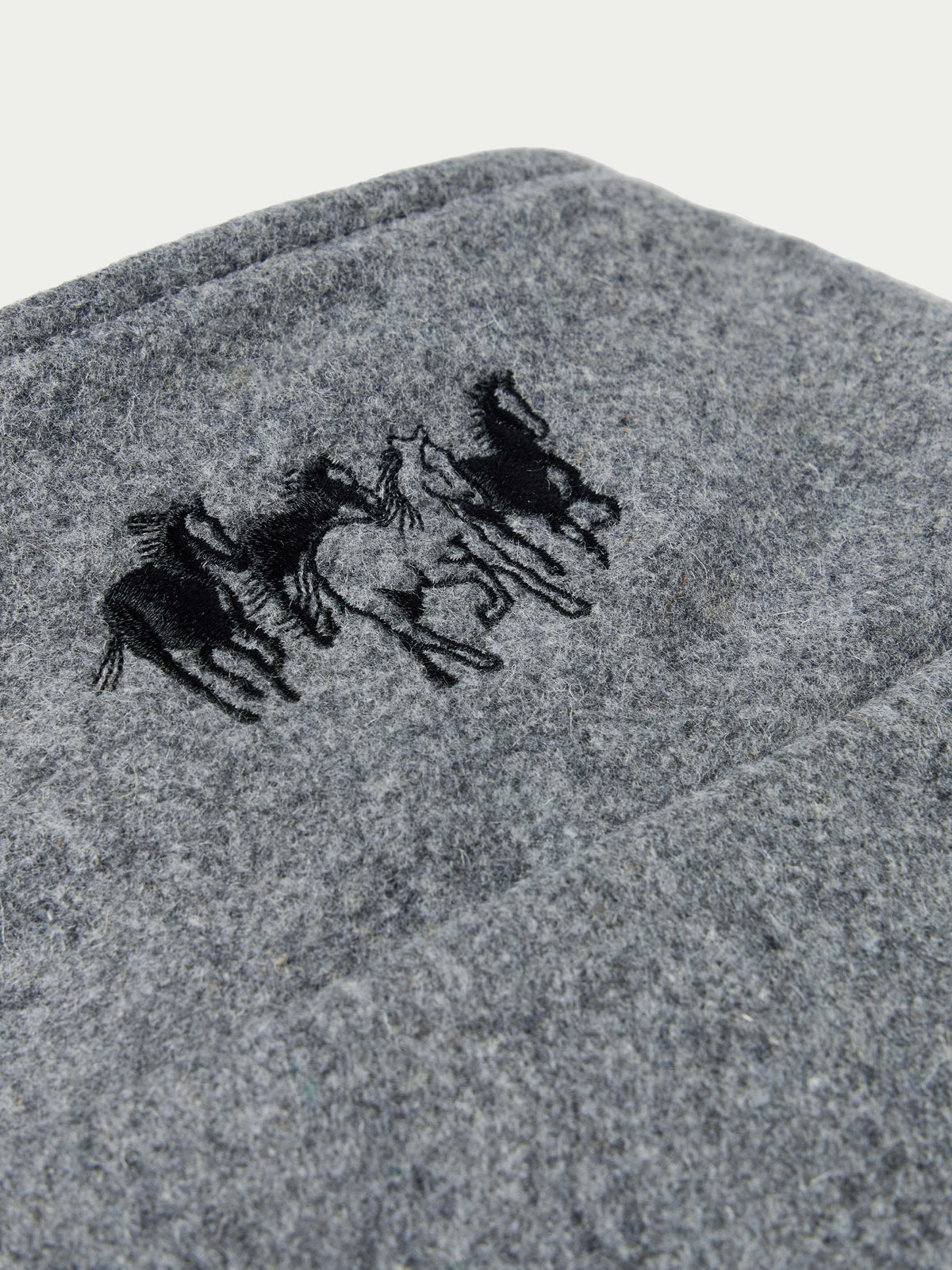 Heather gray wool jacket with black horse logo on upper back