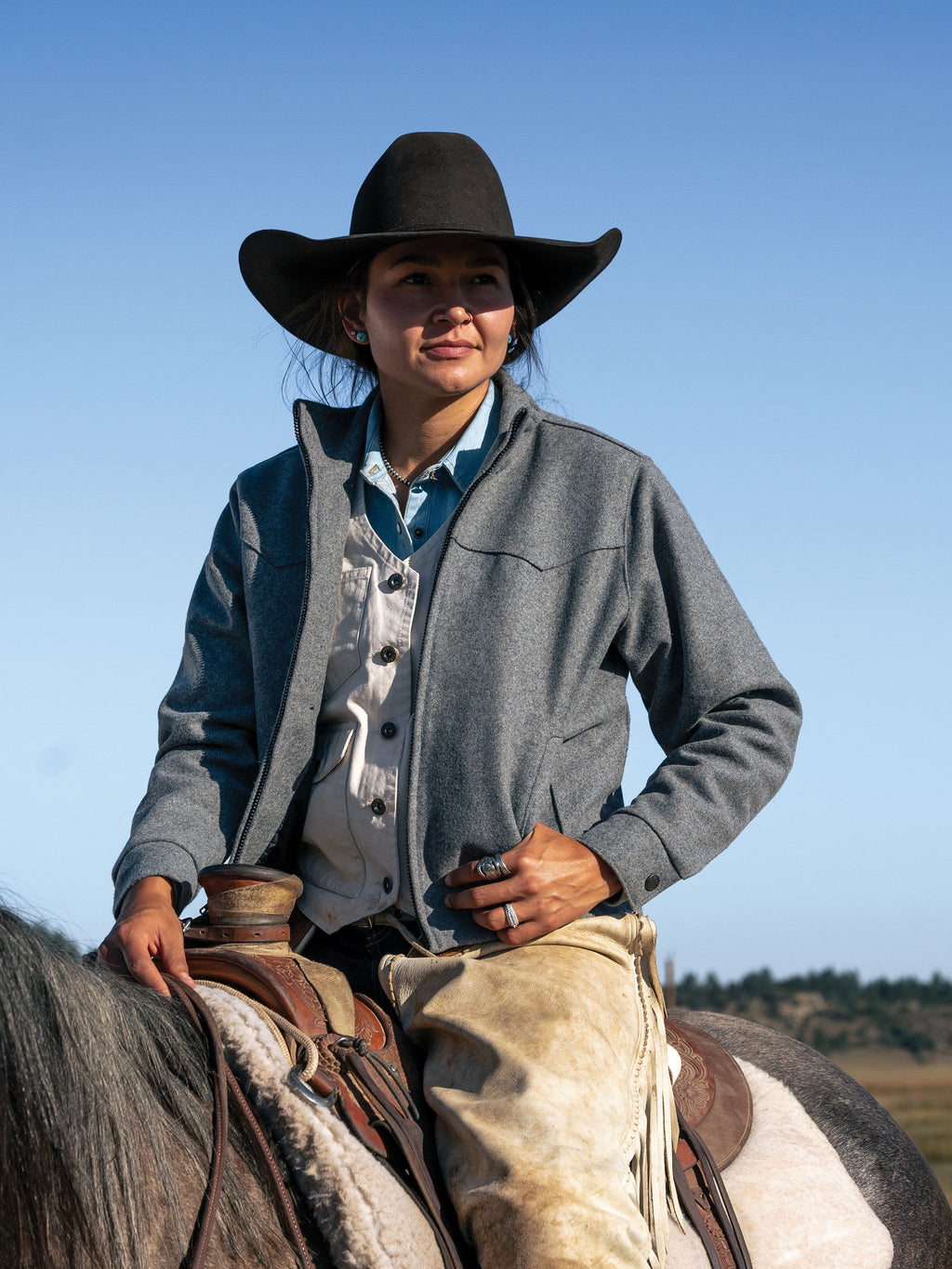 Heather gray wool arena jacket worn with a button-up shirt