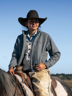 Heather gray wool arena jacket worn with a button-up shirt
