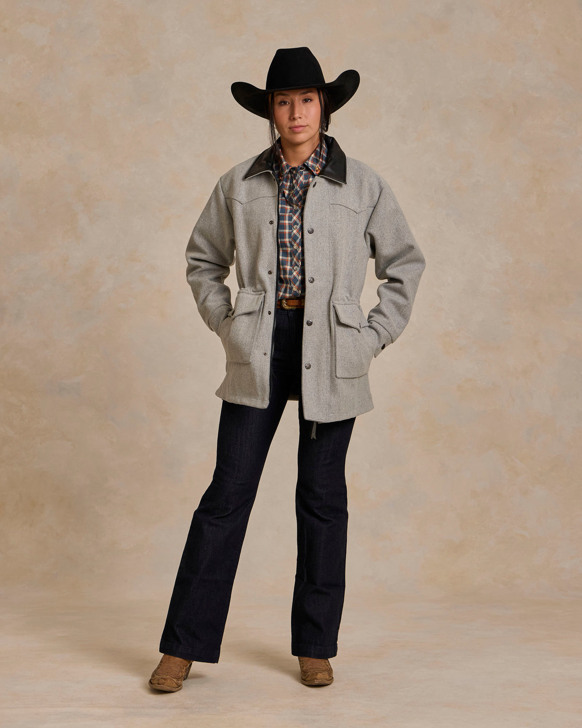 Light gray wool rancher jacket with flap pockets, snap buttons, and waist tie