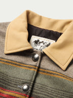 Women’s jacket with tan leather-style collar and striped wool front, snap buttons