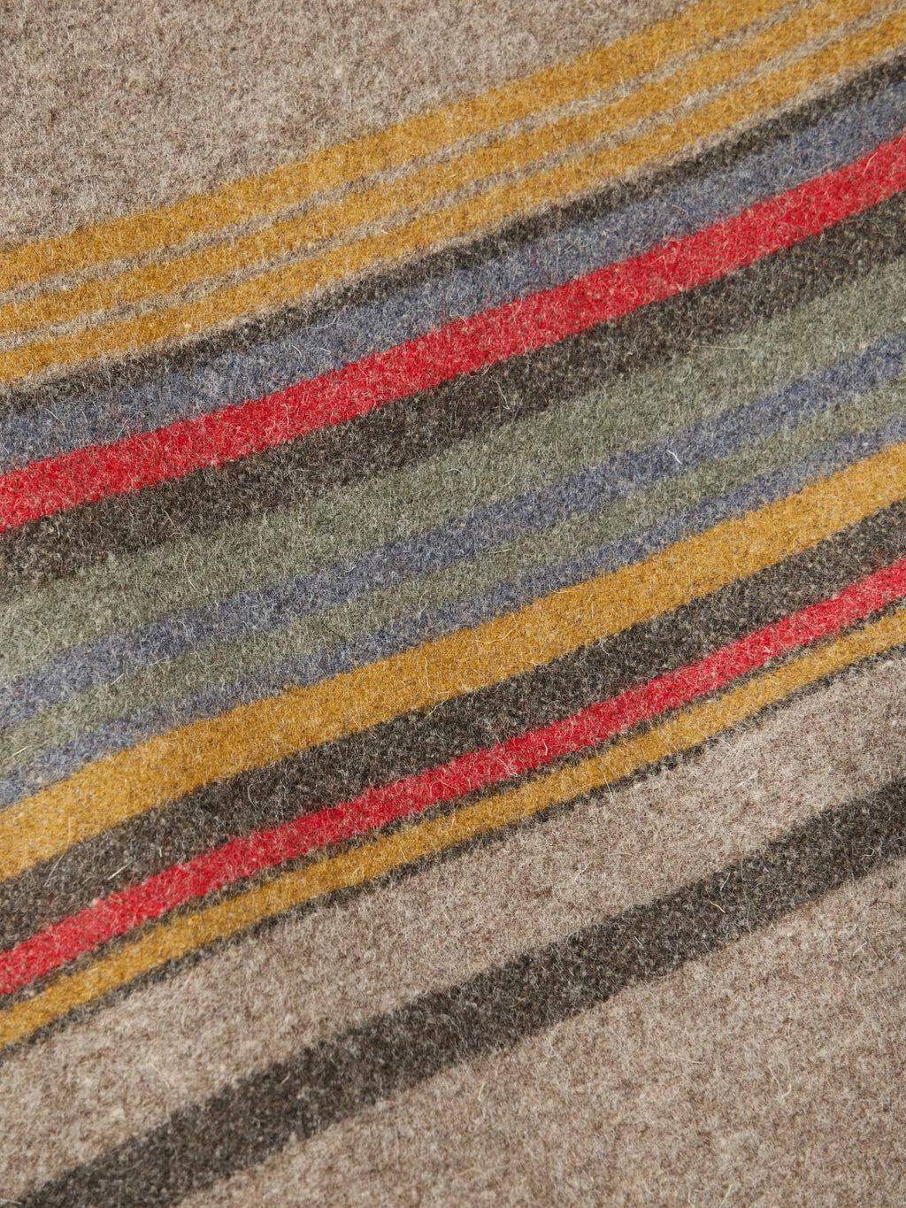 Close-up of taupe striped jacket with multicolor horizontal bands