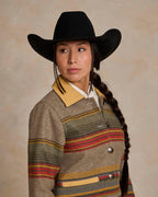 Women’s striped jacket close-up with tan leather-style collar and front snap details