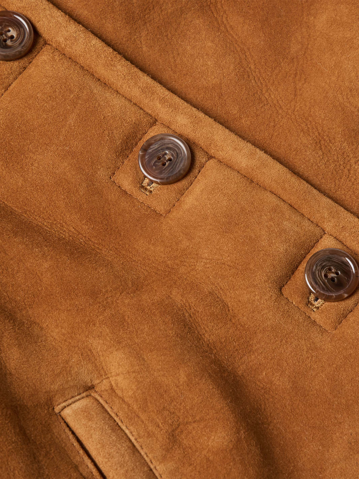 Brown shearling jacket with button placket and stitched chest pockets detail