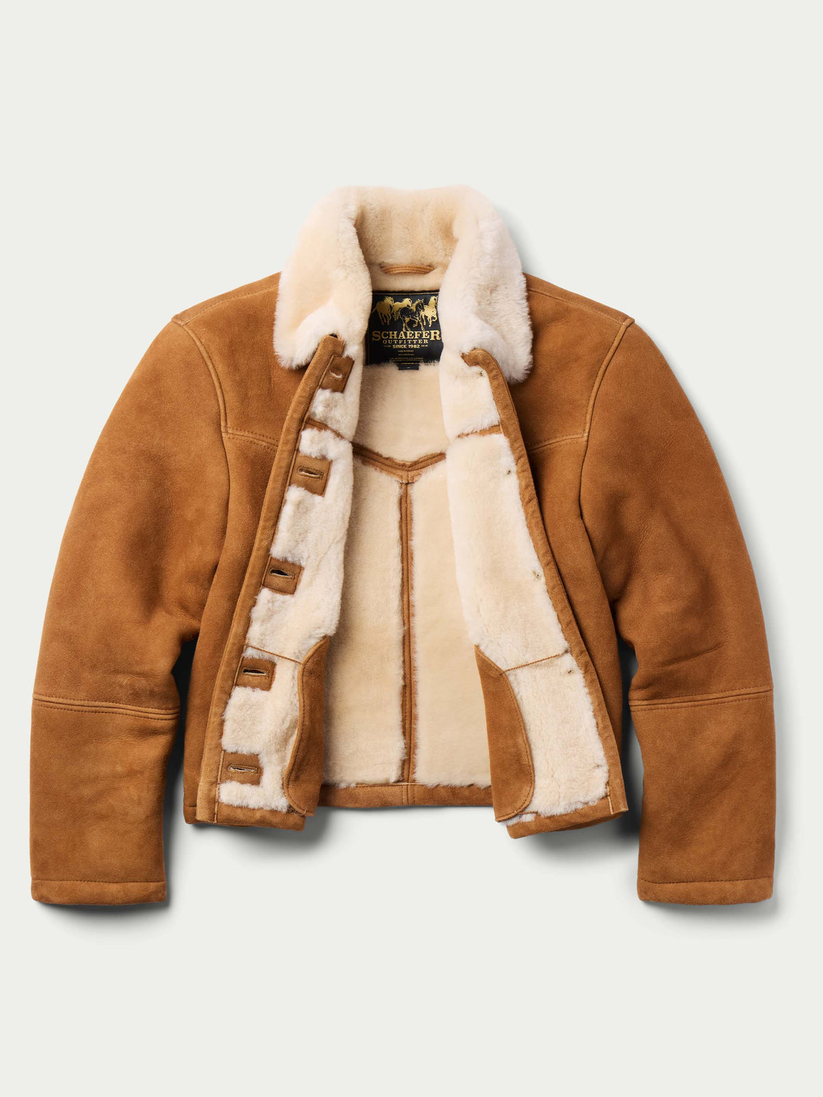 Brown shearling jacket with cream sherpa lining and button front