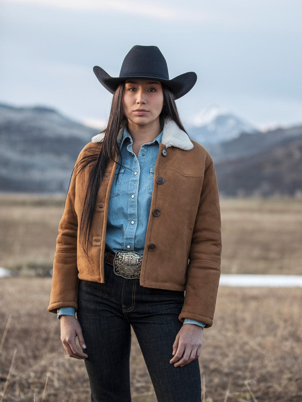 Brown shearling jacket with sherpa-lined collar and front button placket