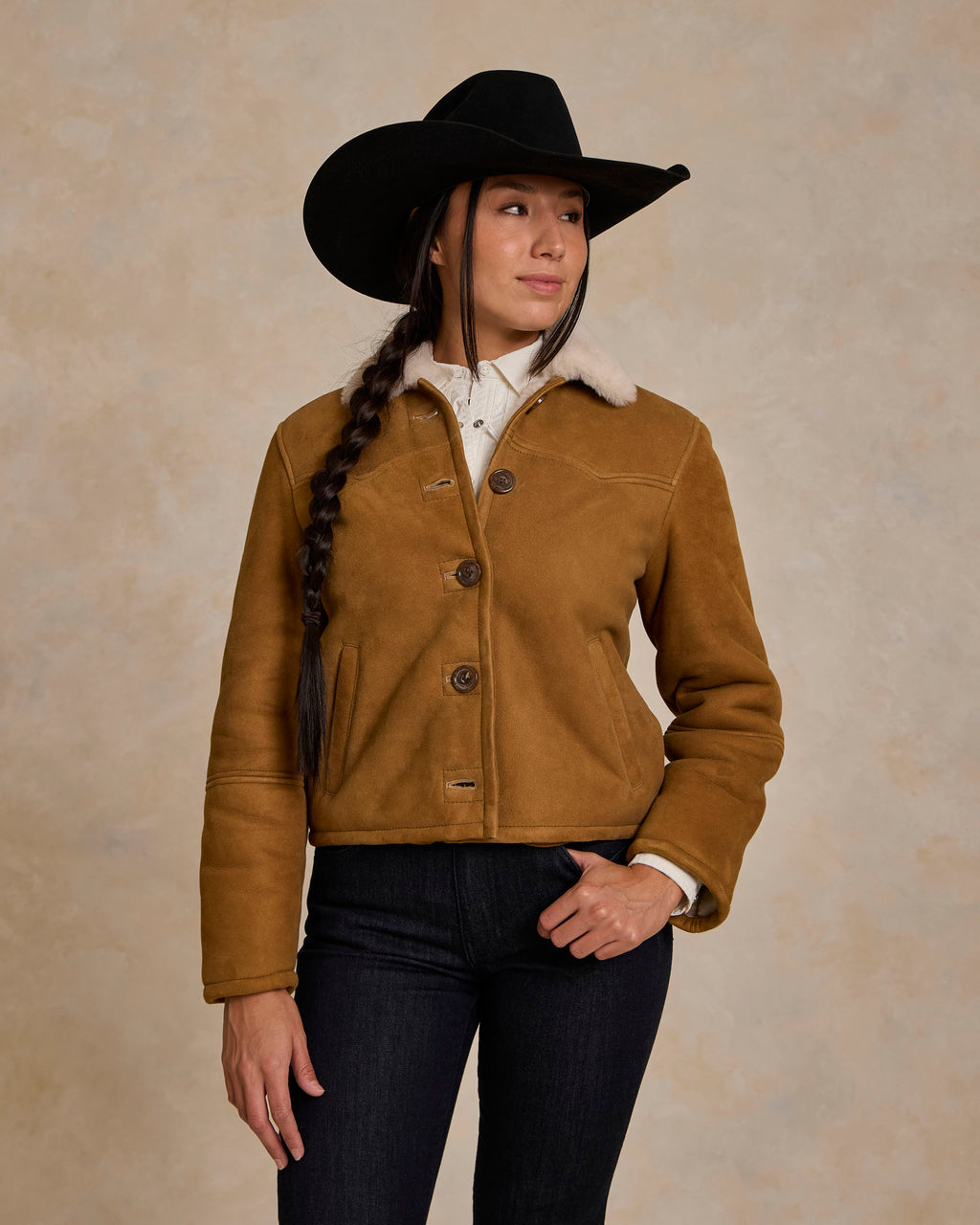 Brown shearling jacket with sherpa collar and chest pockets, buttoned front