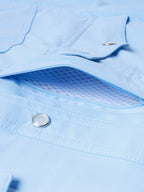 Women’s sky blue snap shirt with chest pocket flap and metal snap button