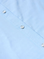 Women’s sky blue Western snap shirt with metal snap buttons along front