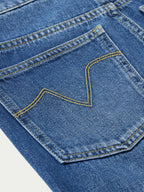 Medium indigo jeans with contrast yellow outlined pocket design