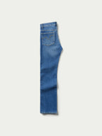 Medium indigo jeans side view with stitched seam detail