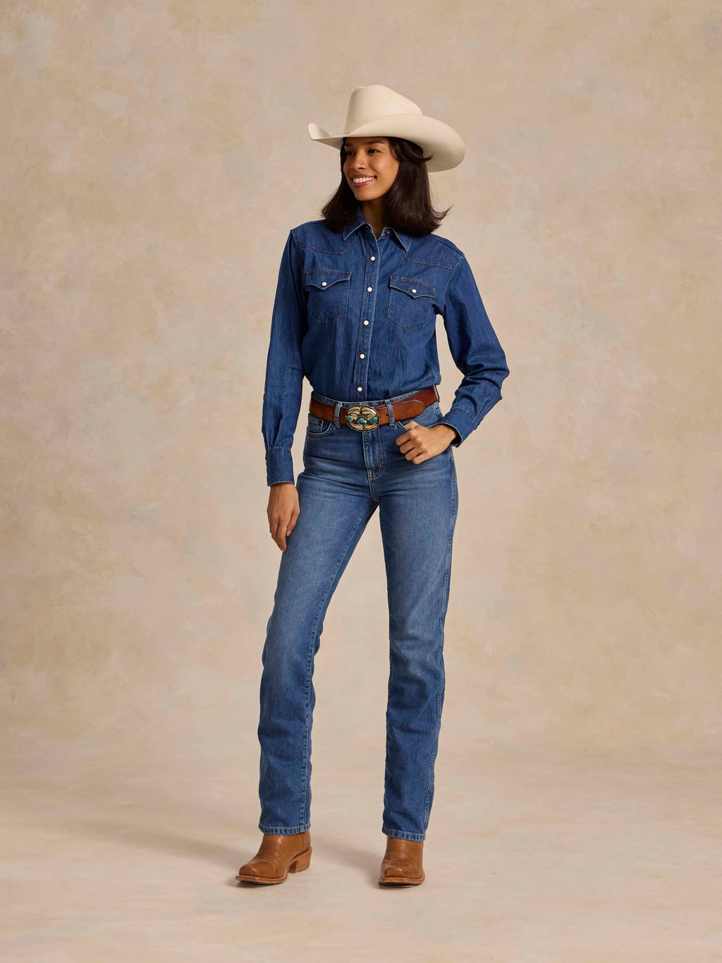 Medium indigo denim jeans with button fly, stitched yoke seams, belt loops and pockets