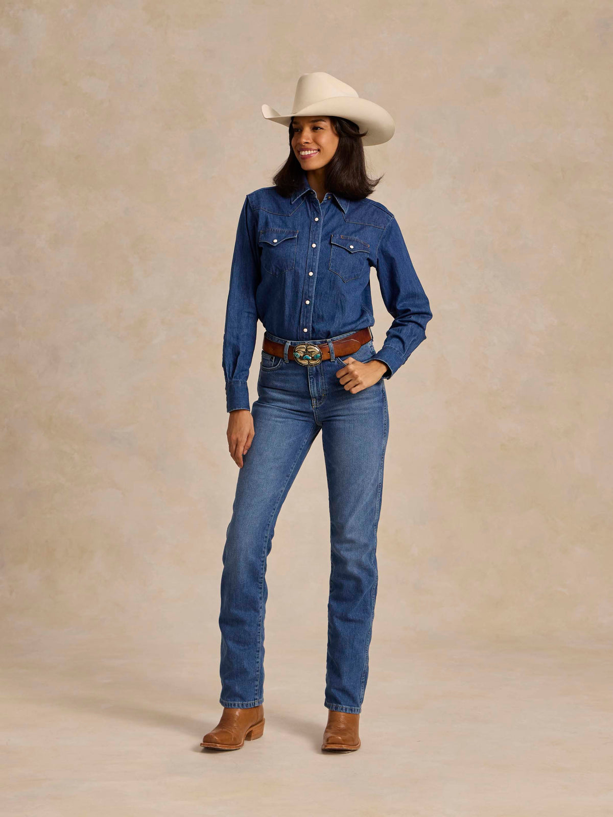 Medium indigo denim jeans with button fly, stitched yoke seams, belt loops and pockets
