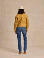 Medium indigo denim jeans, back view with belt loops, patch pockets, straight leg