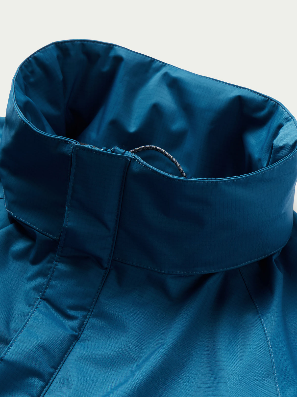 Baltic blue rain jacket hood with interior drawstring channel