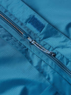 Baltic blue rain jacket front zipper with taped seam and storm flap