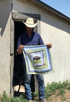 Wild rag scarf held up outdoors, framed buffalo graphic with border