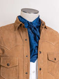 Blue jacquard wild rag scarf with ornate pattern, tied at the neck
