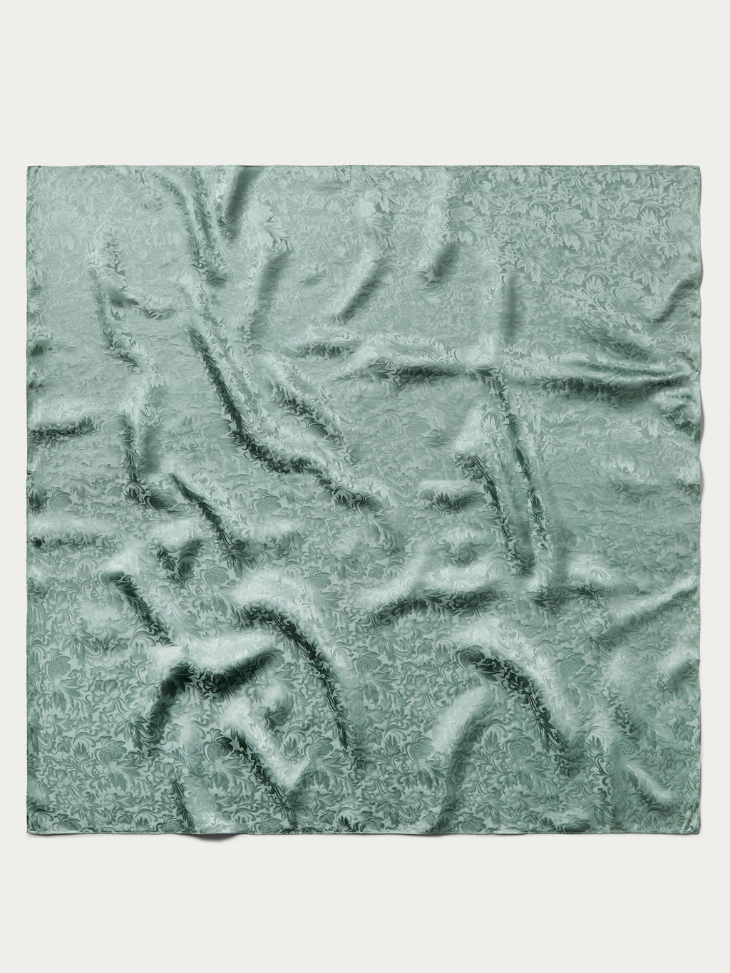Sage green jacquard wild rag fabric with abstract swirling pattern