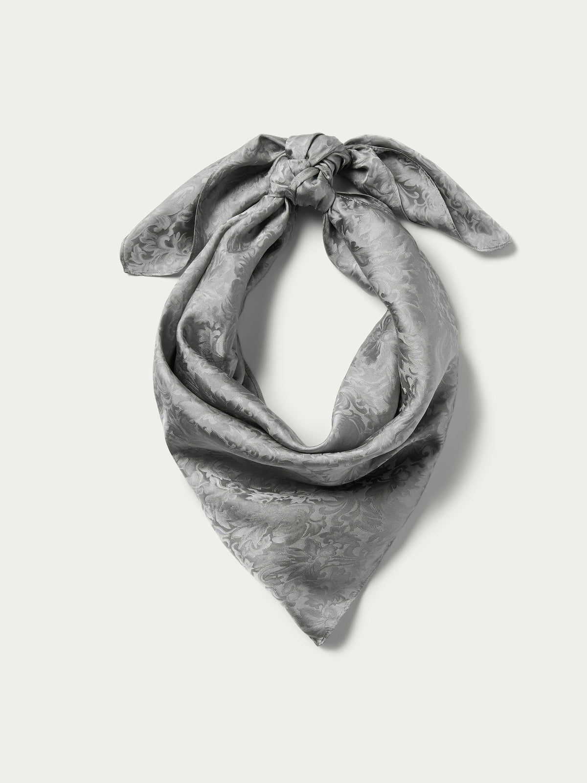 Silver jacquard wild rag neck scarf, tied at the top with flowing drape