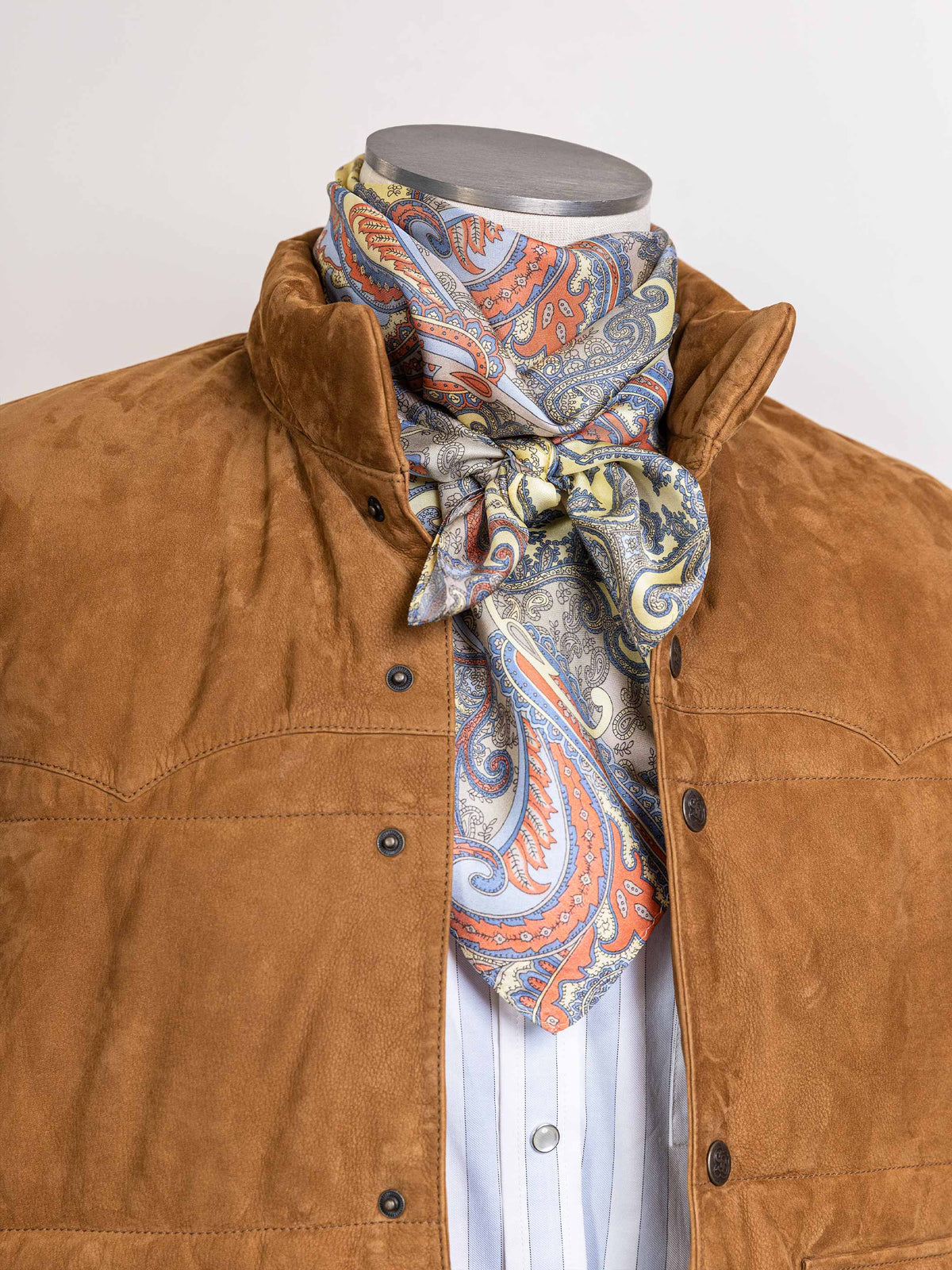 Multicolor paisley neckerchief scarf tied at center, blue, orange, gold