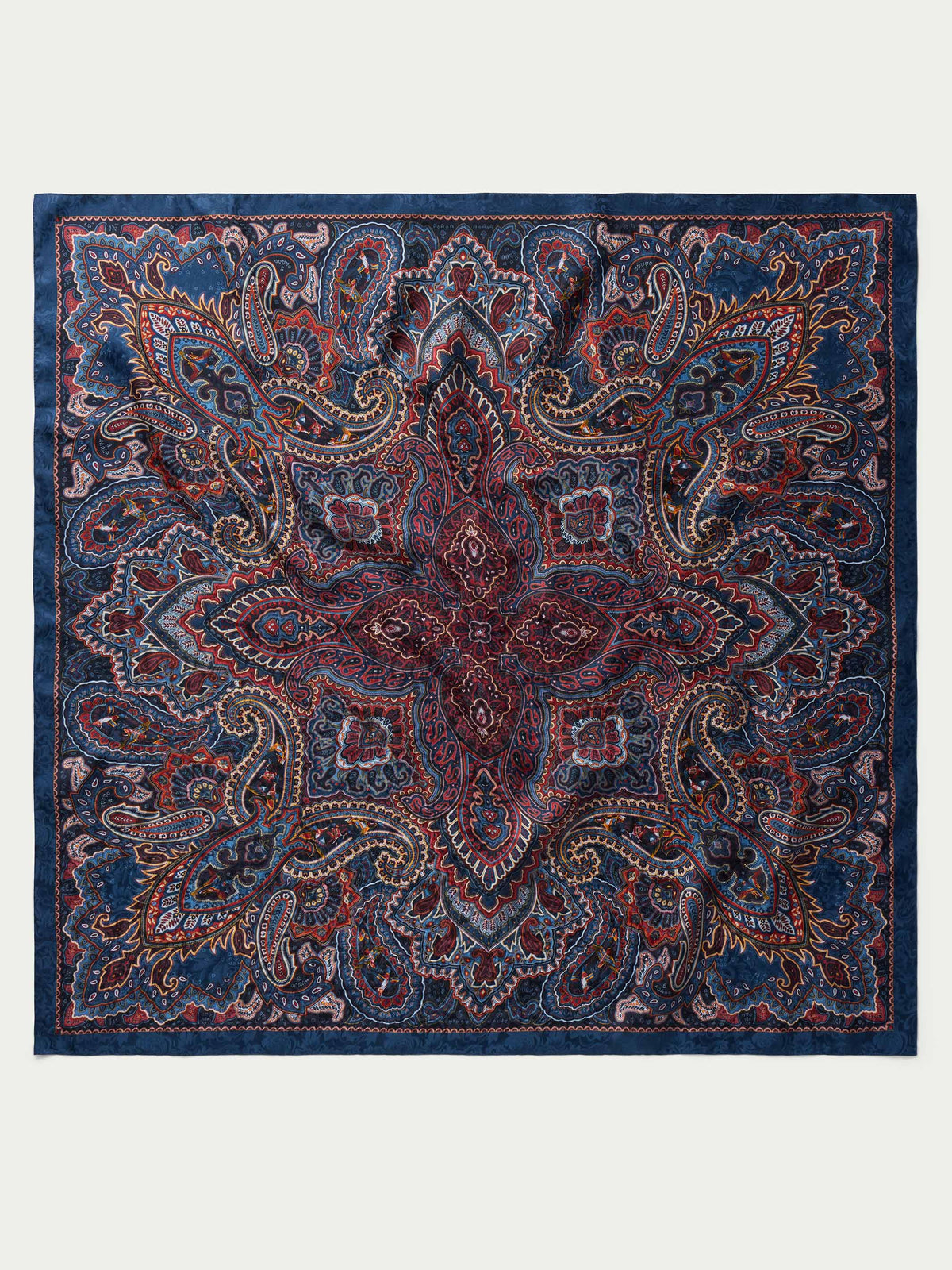 Paisley wild rag scarf in navy with rust paisley and border, square folded