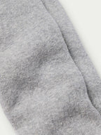 Charcoal gray boot sock fabric close-up with ribbed knit texture