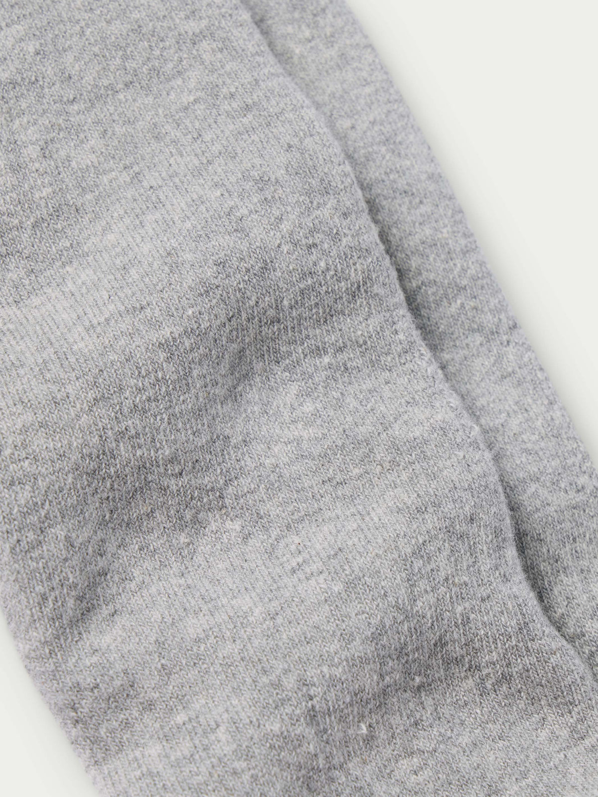 Charcoal gray boot sock fabric close-up with ribbed knit texture