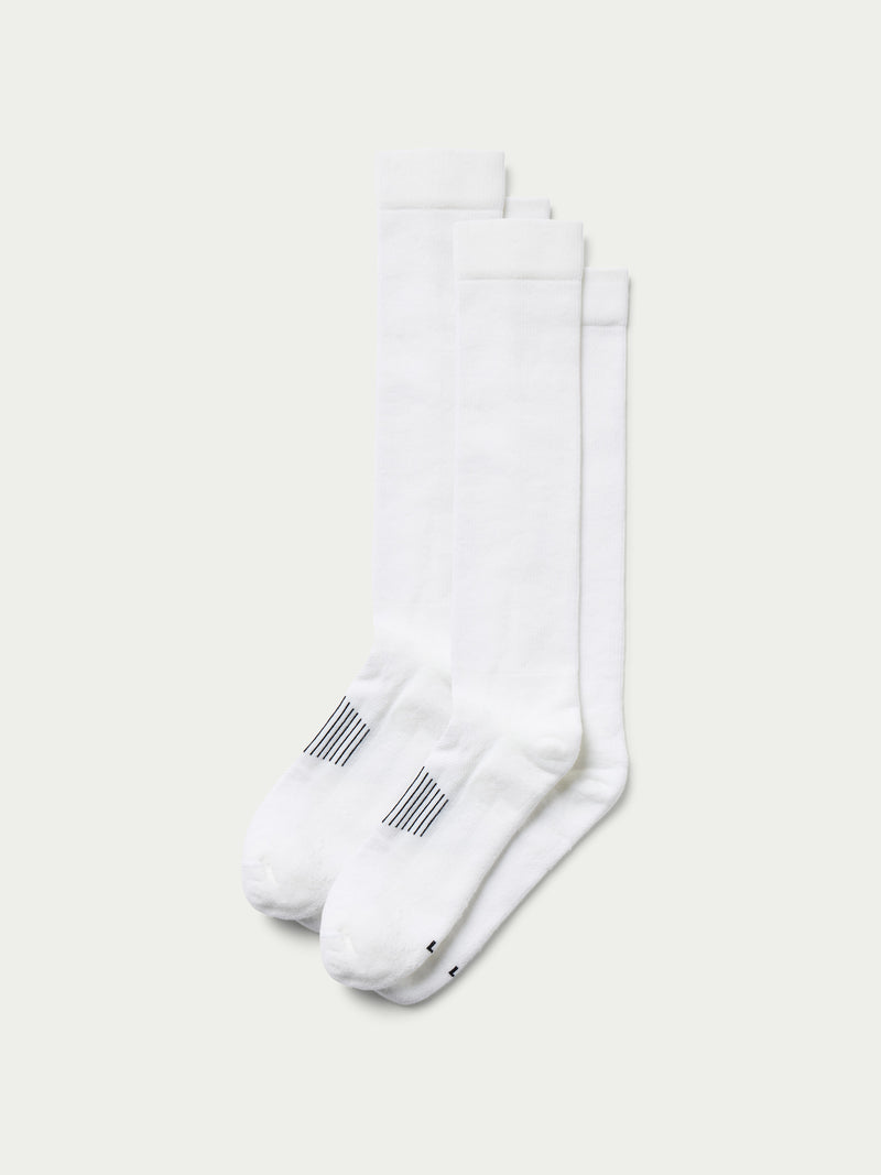 White boot socks with ribbed cuffs and striped logo accents, two-pack