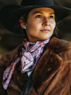 Paisley-pattern wild rag scarf, purple and burgundy print worn at the neck