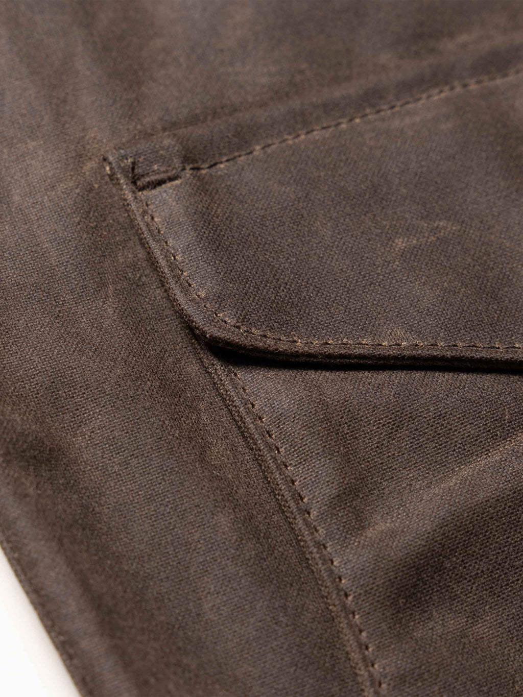 Mesquite vest seam and edge stitching on dark brown fabric